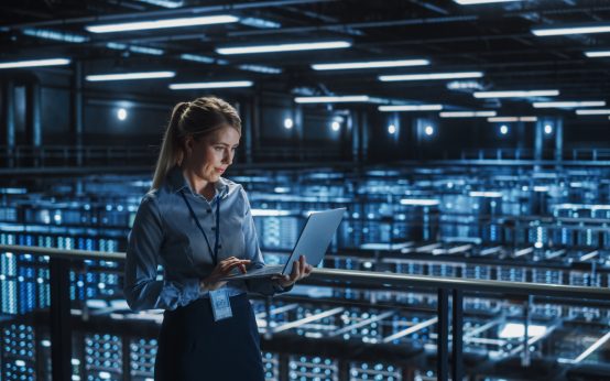 data-center-female-it-specialist-using-laptop-server-farm-cloud-computing-and-cyber-security-maintenance-administrator-working-on-computer-information-technology-professional